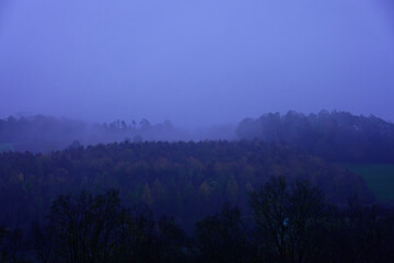 Fog outside the city on a cloudy autumn day in Bavaria.
