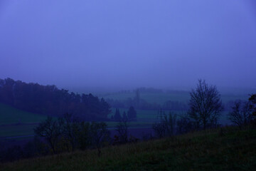 Fog outside the city on a cloudy autumn day in Bavaria.