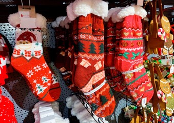 Christmas stockings socks are hanging on store shelves and are ready to be sold in the shop during a Christmas show before the start of the december holiday season