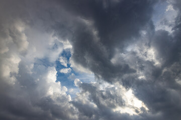 The sky is cloudy and the sun is shining through the clouds