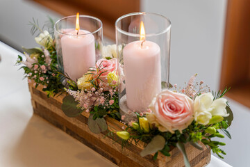 Candles and flowers as decoration on a wedding table