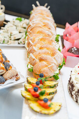 Giant baguette with salad and fruit served at a wedding buffet
