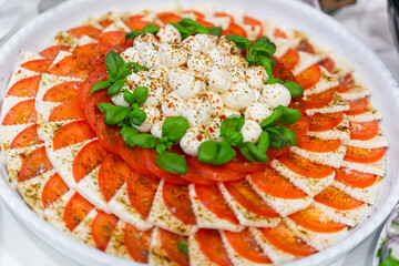 Fresh Caprese tomato and mozzarella appetizer at a wedding party