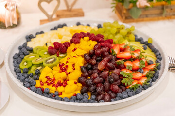 Plate of colorful and fresh fruit at a wedding buffet