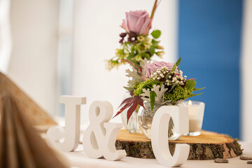 The letters J and C as decoration on a wedding table