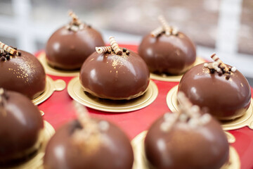 Chocolate tartlets with decoration at a wedding buffet