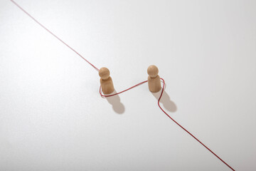 Long red thread isolated on a white background. Red rope