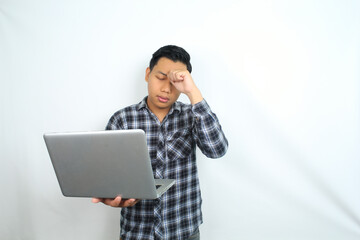 asian man feels dizzy or headache while holding laptop, exhaustion and unhealthy male overworked,...