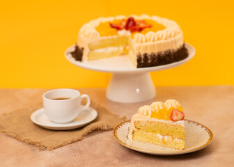 Delicious Cake with Fresh Fruits and Coffee on a Rustic Table Against a Bright Yellow Background