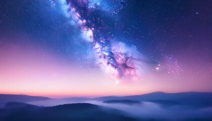 Fototapeta premium Magical night sky over misty mountains. Pink and purple hues paint the twilight.