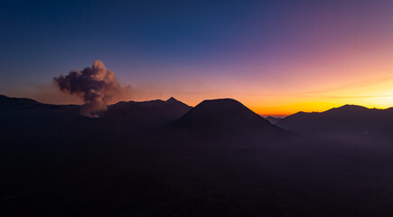 Aerial view Mountains at Bromo volcano during sunrise sky,Beautiful Mountains Penanjakan in Bromo Tengger Semeru National Park,East Java,Indonesia.Nature landscape background