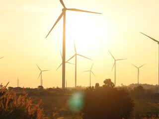 Wind turbines are machines that convert kinetic energy from wind movement to generate electricity.