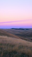 Rolling hills and purple sky creating stunning sunset landscape
