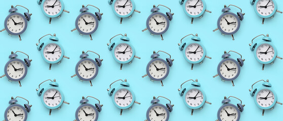 Alarm clocks on blue background