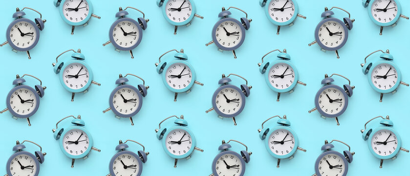 Alarm clocks on blue background