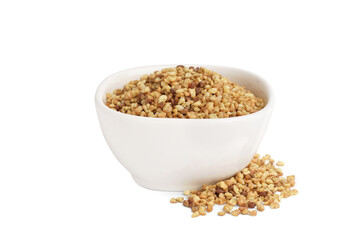 Bowl with raw buckwheat grains on white background