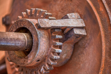 farm equipment, vintage rusty grinder and pinion at a south african farm, machine parts for agriculture
