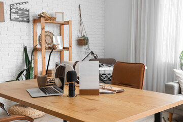 Podcaster's workplace with microphone and laptop in studio