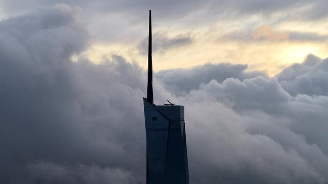 dramatic sunrise with low cloud above Kuala Lumpur city center visible sky scraper tower above the cloud