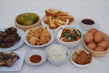 traditional Indonesian food arranged neatly on a white surface