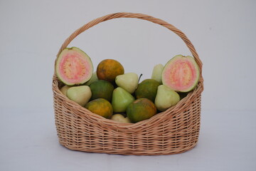 A wicker basket filled with a variety of fresh fruits