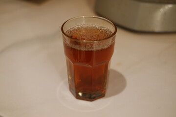 hot tea in glass on table. Selective focus and shallow depth of field.