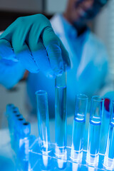 a scientist is happily work in the laboratory, a science researcher is working on his project about discover a new formula of anti-virus, microscope, report, laboratory and scientist concept