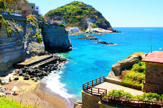 ISCHIA, ITALY - CIRCA JULY 2016: Cava Ruffano in Ischia. Small beach in the scrub of Serrara Fontana, near Sant'Angelo: rocky spurs, coarse-grained sand and crystalline waters with emerald shades