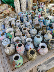 Glazed terracotta pots mugs cups plates with colorful textures unique from China background