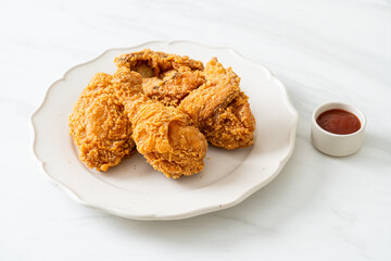 fried chicken with ketchup on plate