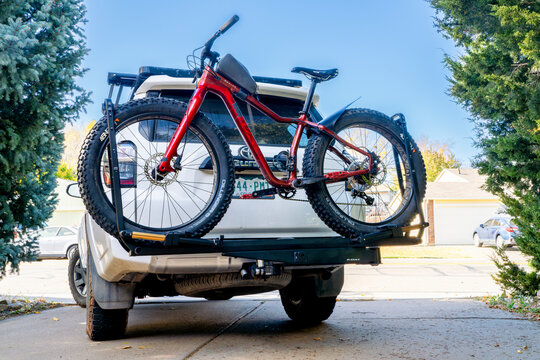 Fort Collins, CO, USA - October 25, 2024: Salsa Mukluk fat bike on the back of Toyota 4Runner SUV mounted with Kuat piston hitch rack.