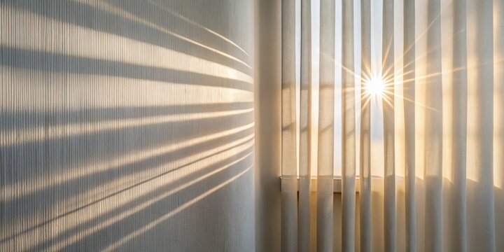 Sunlight streams through sheer vertical blinds, casting soft, parallel shadows on a textured wall.