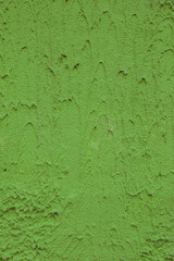 Vertical photo of old, uneven plaster.