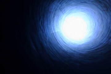 Light at the end of the tunnel - light shining through at the upper right of frame