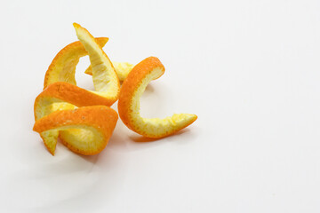 Close-up of fresh orange peel on white background