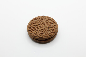 Sandwich cookies, chocolate cream filled biscuits isolated on white background, full depth of field