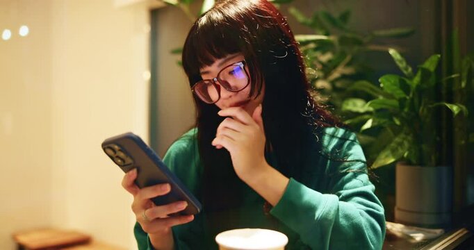 Japanese woman, thinking and typing with smartphone for social media, mobile notification and tea in cafe. Customer, phone and search with restaurant, matcha beverage and texting for online chat