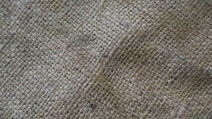 A rustic burlap  isolated white bakground, perfect textured backdrop for showcasing vintage DIY craft products katalog, copy space