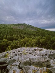 Čertova stěna natural rock formation, nestled in South Bohemian forests with a moody atmosphere, showcasing the raw landscape of the region