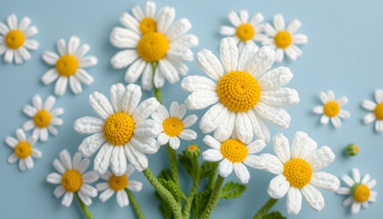 Fototapeta premium Beautiful white daisies made by hand in crochet and wool. Daisies pattern on blue background. Amigurumi design