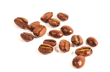 Obraz premium Top view of brown roasted coffee beans isolated on white background, for background, illustration and pattern design.