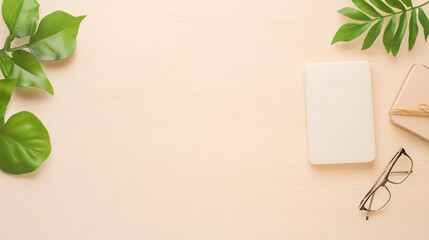 A vibrant product mockup template displayed on a textured wooden table surface, surrounded by minimal decor elements like green leaves and stationary items. The background fades softly, directing