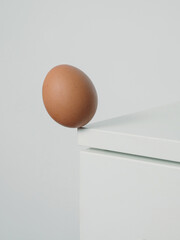 Egg on the edge before falling, egg on the corner of the table