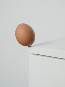 Egg on the edge before falling, egg on the corner of the table