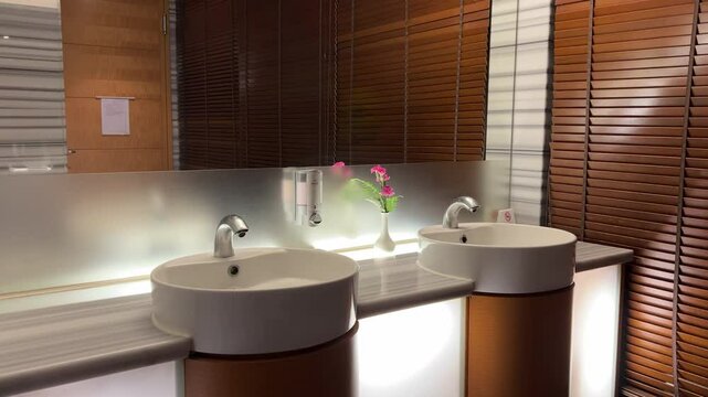 Luxurious Hotel Bathroom: Automatic Sensor Sink with Elegant Floral Decor