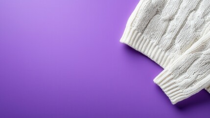 Showcasing sweater with cableknit sleeves soft lavender background fashion photography cozy environment close-up view textile concept