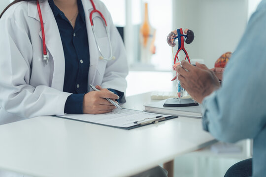 Doctor-Patient Consultation: A close-up perspective captures the intimate moment between a doctor and patient during a consultation. The doctor, focused on her notes.