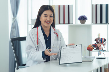 Smiling Female Doctor Presenting Medical Report 