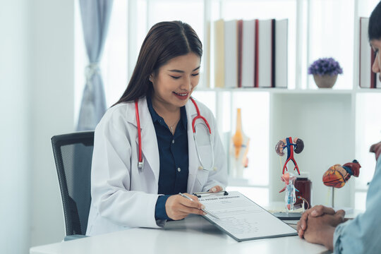Doctor and Patient Consultation: A friendly female doctor in a white coat engages in a compassionate and attentive conversation with her patient.