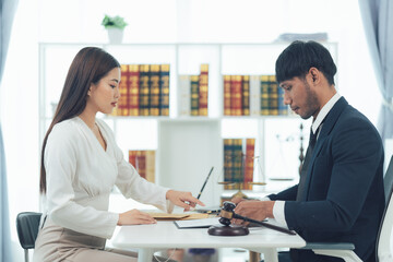 Legal Consultation: Focused Lawyers Reviewing Documents 